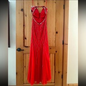 Orange/red formal dress. Never been worn